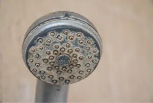 Shower head showing hardness deposits